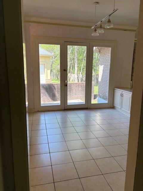 1417 Wyndmere Dr, Desoto, TX 75115 - entryway with light tile patterned floors and ornamental molding