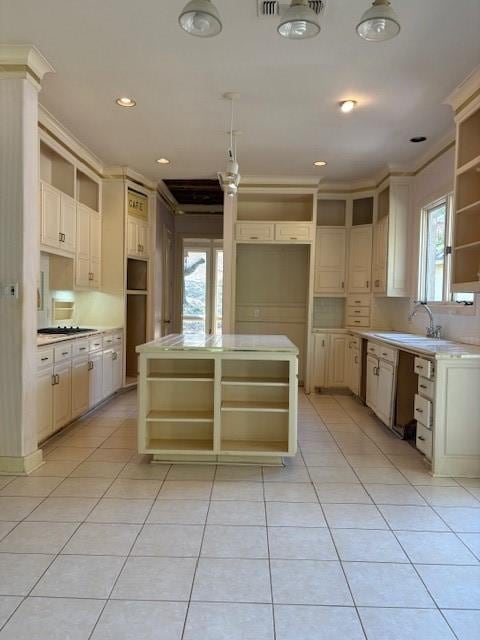 1417 Wyndmere Dr, Desoto, TX 75115 - kitchen with a sink, light tile patterned floors, a center island, and open shelves
