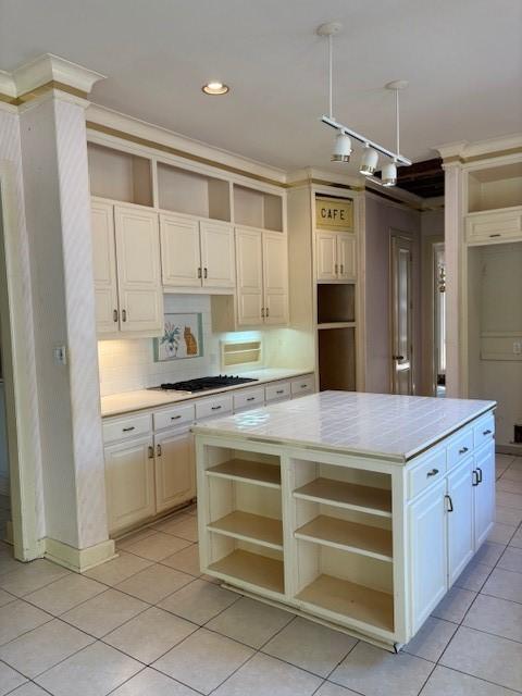 1417 Wyndmere Dr, Desoto, TX 75115 - kitchen with gas stovetop, light tile patterned floors, light countertops, and open shelves