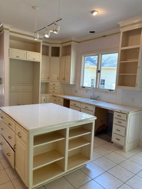 1417 Wyndmere Dr, Desoto, TX 75115 - kitchen with decorative backsplash, light tile patterned floors, a sink, and open shelves