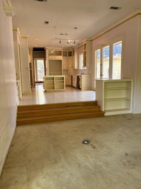 1417 Wyndmere Dr, Desoto, TX 75115 - unfurnished living room with light carpet, visible vents, and crown molding