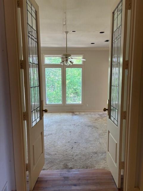 1417 Wyndmere Dr, Desoto, TX 75115 - doorway to outside with baseboards, ceiling fan, crown molding, wood finished floors, and carpet flooring