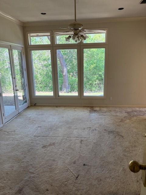 1417 Wyndmere Dr, Desoto, TX 75115 - unfurnished room featuring ceiling fan, carpet, ornamental molding, visible vents, and baseboards