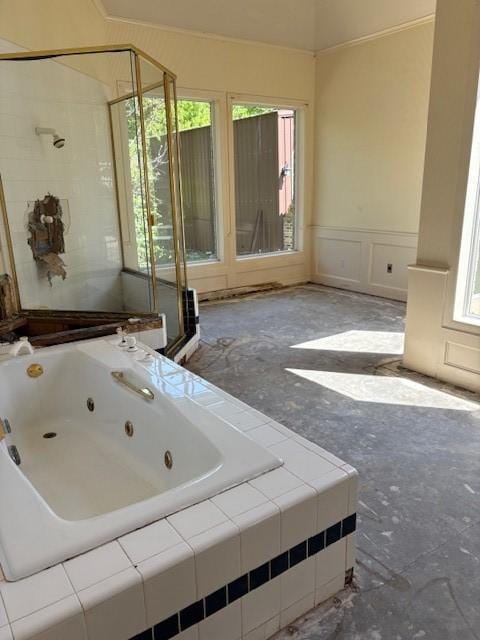 1417 Wyndmere Dr, Desoto, TX 75115 - bathroom with plenty of natural light, a jetted tub, a stall shower, and a decorative wall