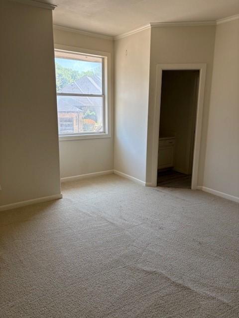 1417 Wyndmere Dr, Desoto, TX 75115 - unfurnished bedroom featuring carpet, baseboards, and crown molding