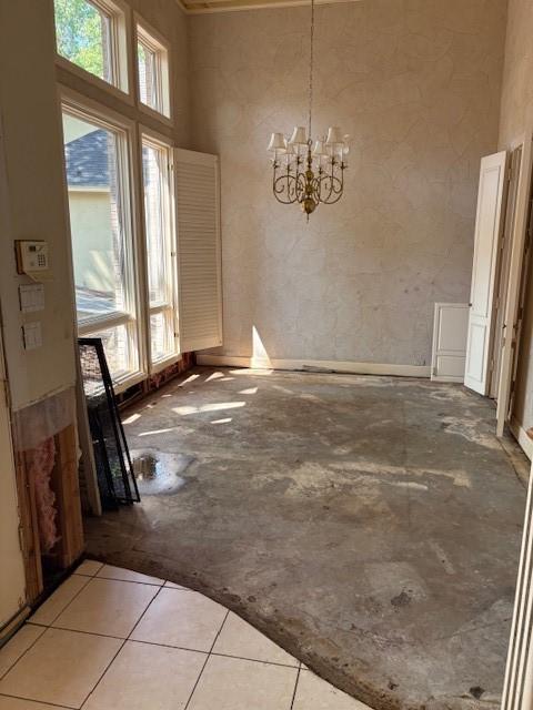 1417 Wyndmere Dr, Desoto, TX 75115 - unfurnished dining area featuring an inviting chandelier and a towering ceiling
