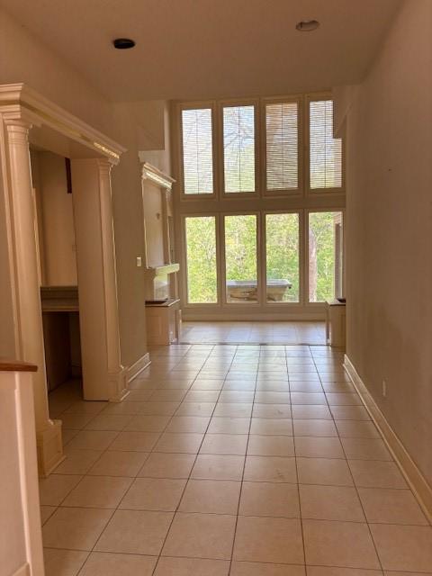 1417 Wyndmere Dr, Desoto, TX 75115 - interior space featuring light tile patterned flooring, baseboards, and a wealth of natural light