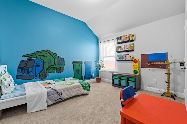 carpeted bedroom featuring baseboards and lofted ceiling