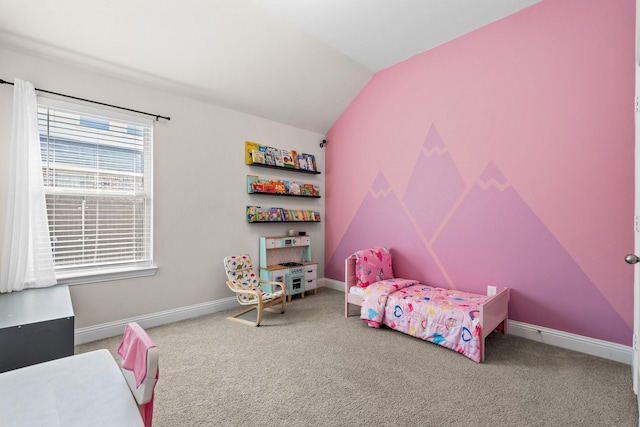 bedroom with baseboards, lofted ceiling, and carpet floors