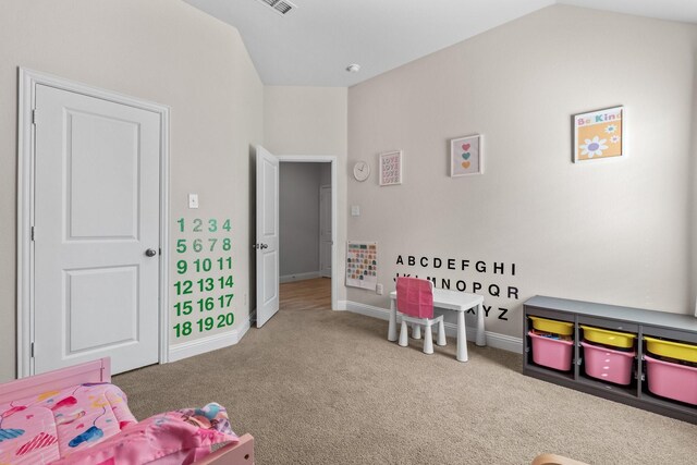 recreation room with baseboards, carpet flooring, and lofted ceiling