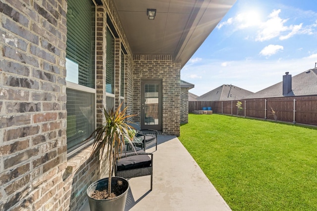 view of yard with a patio area and a fenced backyard