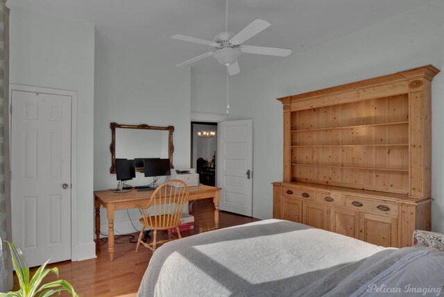 bedroom featuring vaulted ceiling and wood finished floors