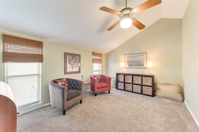 sitting room featuring ceiling fan, baseboards, lofted ceiling, and carpet floors