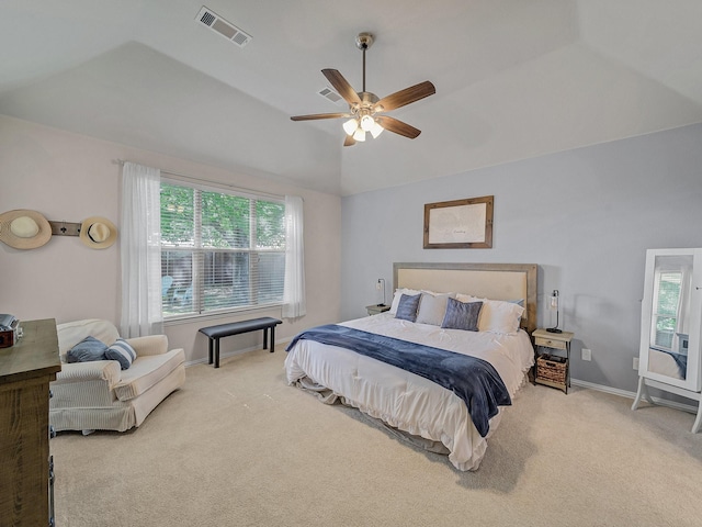 bedroom featuring visible vents, multiple windows, vaulted ceiling, and carpet floors