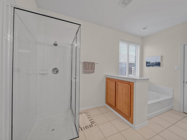 bathroom featuring a stall shower, visible vents, and tile patterned floors