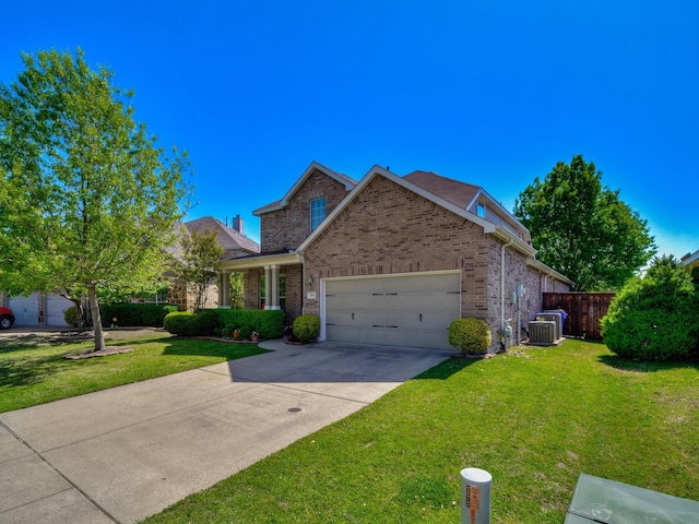 traditional-style home with a garage, concrete driveway, brick siding, and a front lawn