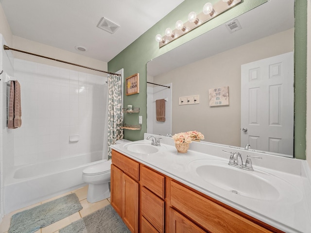 full bathroom featuring tile patterned floors, visible vents, and a sink