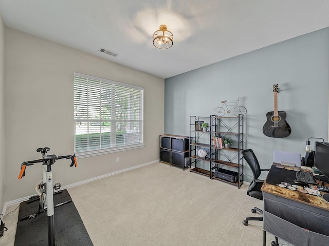 office space featuring visible vents, baseboards, and carpet flooring