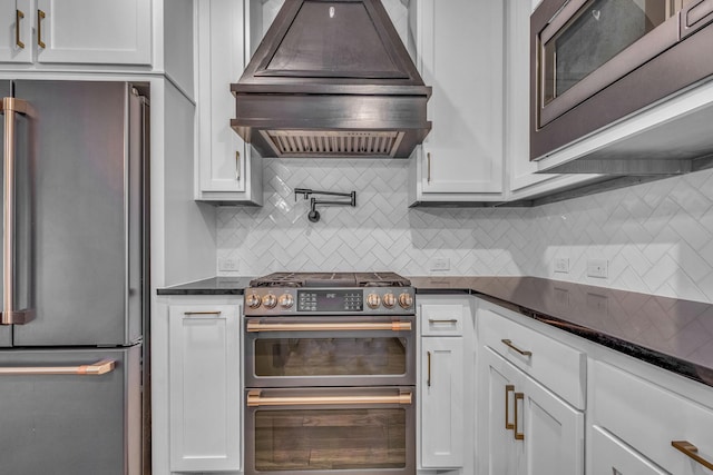 14229 Walsh Ave, Fort Worth, TX 76008 - kitchen featuring appliances with stainless steel finishes, premium range hood, white cabinetry, and tasteful backsplash