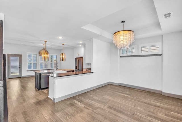 14229 Walsh Ave, Fort Worth, TX 76008 - kitchen featuring a chandelier, stainless steel appliances, wood finished floors, healthy amount of natural light, and recessed lighting