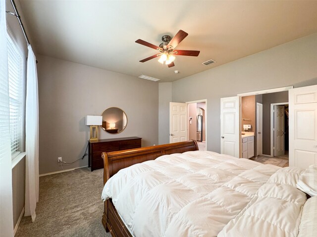 bedroom featuring ceiling fan, light colored carpet, and baseboards