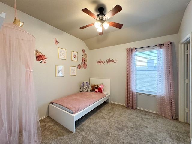 carpeted bedroom with baseboards, vaulted ceiling, and a ceiling fan
