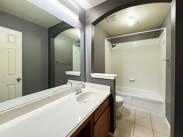 bathroom with vanity, tile patterned flooring, toilet, visible vents, and shower / bathing tub combination
