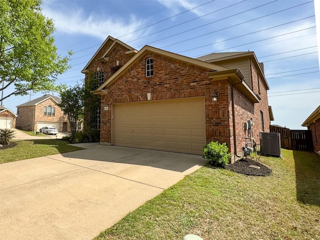 view of side of home with a garage, fence, brick siding, driveway, and central AC unit