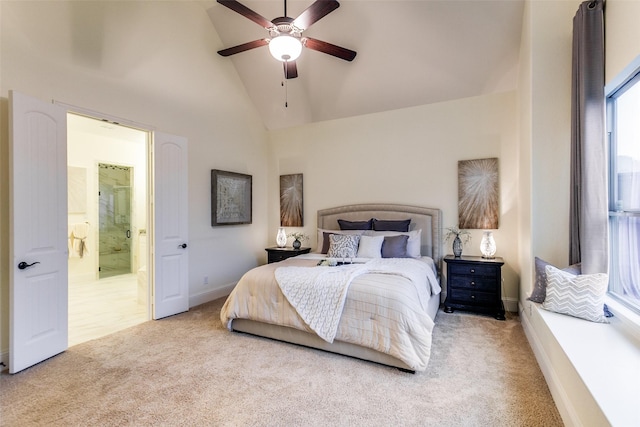 bedroom with high vaulted ceiling, a ceiling fan, baseboards, carpet floors, and ensuite bathroom