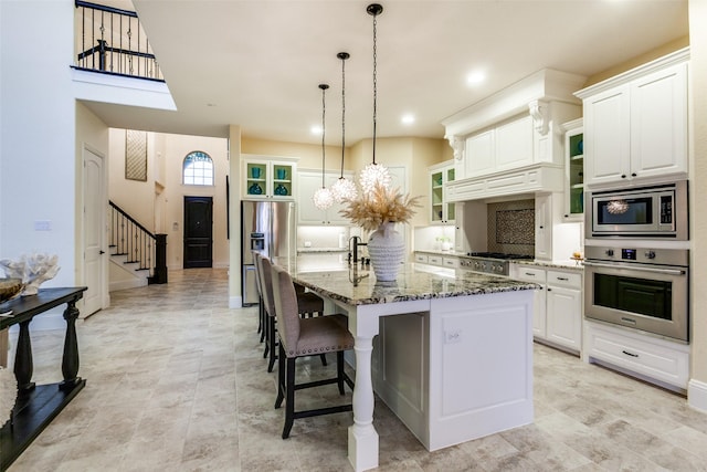 2018 Barley Place Dr, Allen, TX 75013 - kitchen with stainless steel appliances, glass insert cabinets, stone counters, a kitchen breakfast bar, and a large island