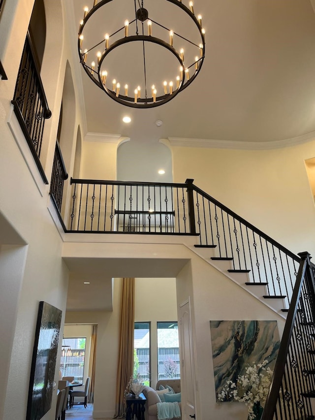 2018 Barley Place Dr, Allen, TX 75013 - staircase with a towering ceiling, a chandelier, and crown molding