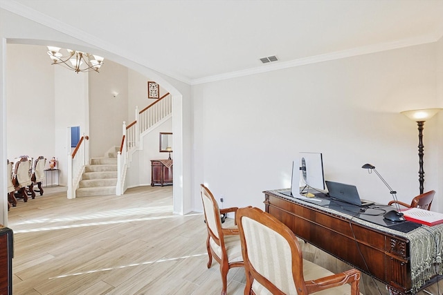 501 Maple Leaf Ln, Mckinney, TX 75071 - office area with light wood finished floors, a chandelier, ornamental molding, arched walkways, and baseboards