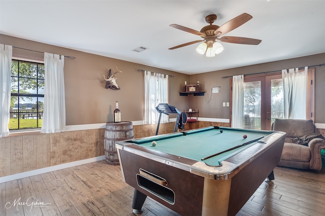 game room with pool table, a ceiling fan, a wainscoted wall, visible vents, and light wood finished floors
