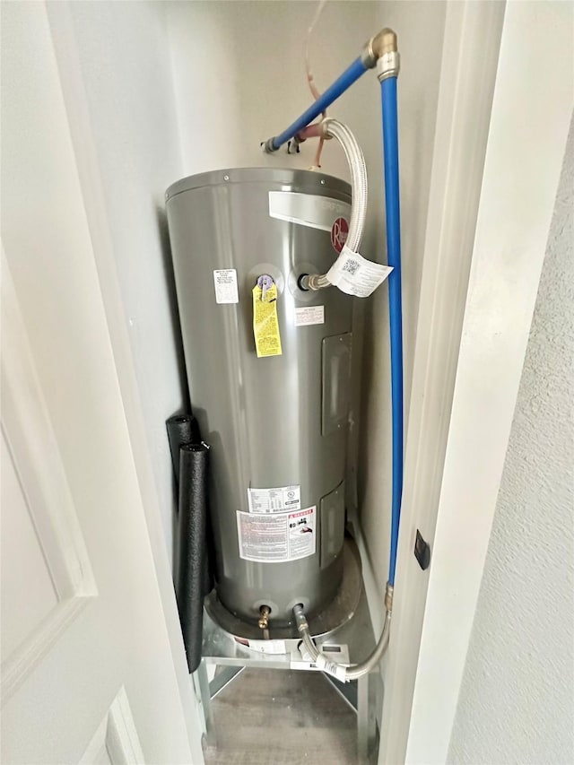 utility room with water heater