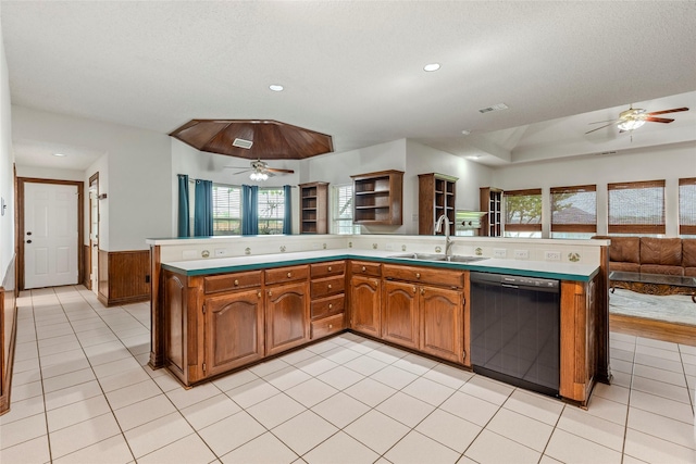 kitchen with a sink, a ceiling fan, black dishwasher, and open floor plan