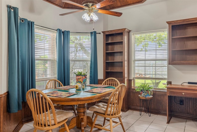 dining space featuring a ceiling fan, light tile patterned floors, and a wealth of natural light