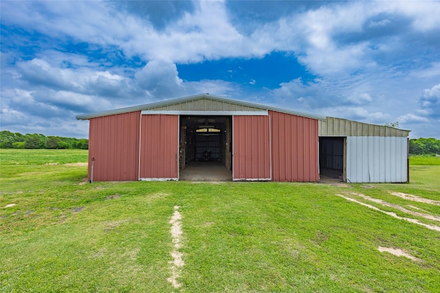 view of pole building with a yard