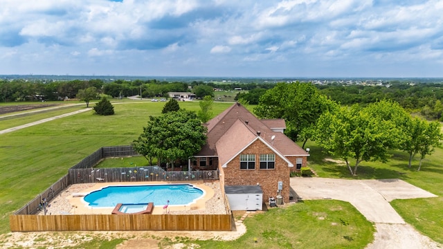 view of swimming pool featuring a yard, a fenced in pool, and a fenced backyard