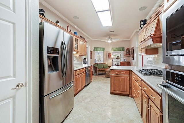 104 Fm 2450, Krum, TX 76249 - kitchen featuring appliances with stainless steel finishes, light countertops, a peninsula, crown molding, and light tile patterned floors