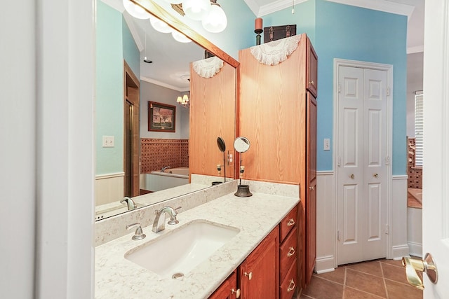 104 Fm 2450, Krum, TX 76249 - full bath with ornamental molding, tile patterned floors, a chandelier, a wainscoted wall, and vanity