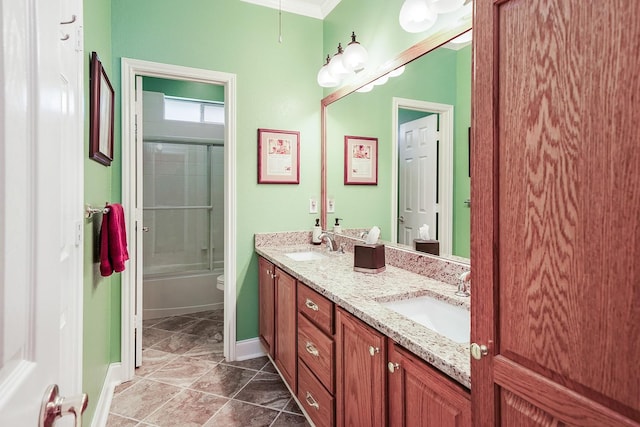 104 Fm 2450, Krum, TX 76249 - bathroom featuring toilet, double vanity, baseboards, and enclosed tub / shower combo