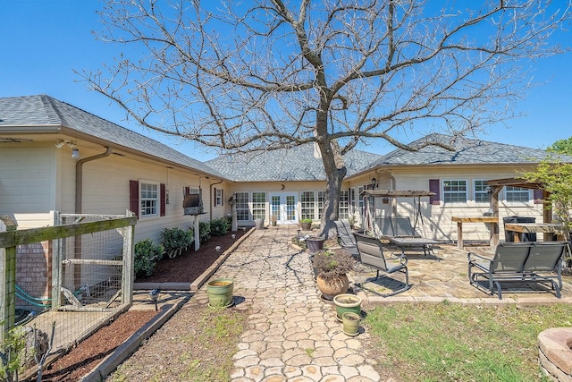 104 Fm 2450, Krum, TX 76249 - rear view of house with a patio and roof with shingles