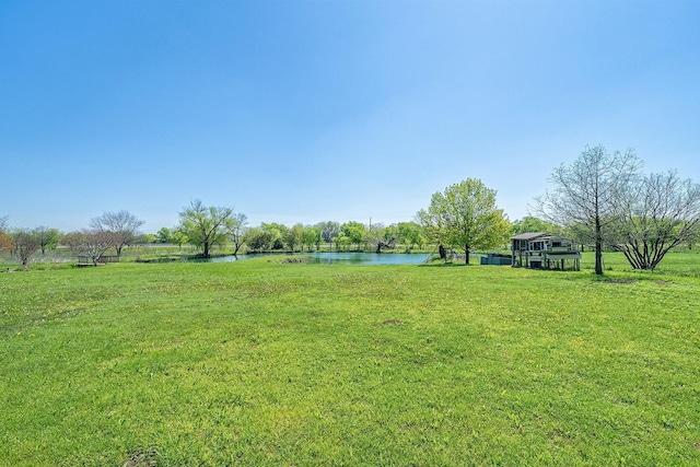 104 Fm 2450, Krum, TX 76249 - view of green lawn featuring a water view
