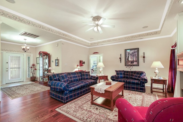 104 Fm 2450, Krum, TX 76249 - living area with wood finished floors, a ceiling fan, a chandelier, ornamental molding, and a raised ceiling