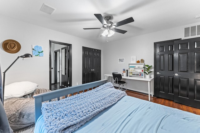 bedroom with wood finished floors and a ceiling fan
