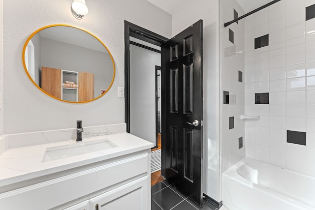 bathroom with vanity, tile patterned floors, and tub / shower combination