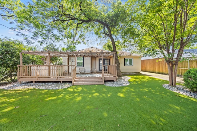 rear view of property featuring a pergola and a deck