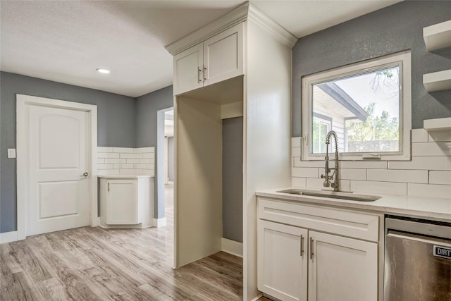 110 Pine St, Weatherford, TX 76086 - kitchen with tasteful backsplash, dishwasher, light countertops, and a sink