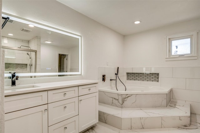 110 Pine St, Weatherford, TX 76086 - full bathroom featuring vanity, a stall shower, a bath, visible vents, and marble finish floor