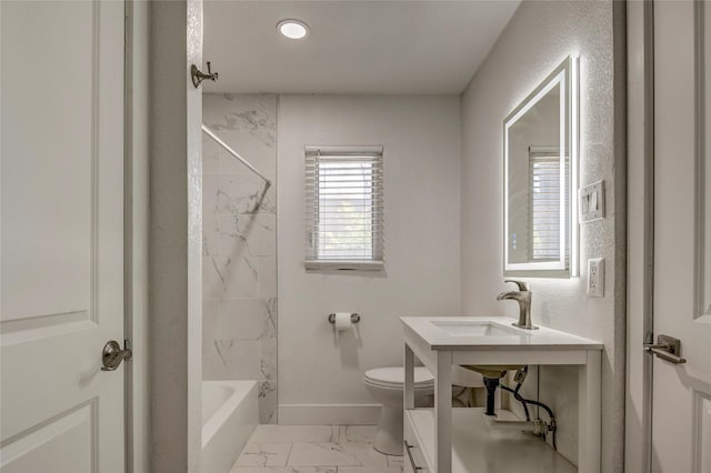 110 Pine St, Weatherford, TX 76086 - bathroom featuring bathing tub / shower combination, toilet, marble finish floor, a sink, and baseboards